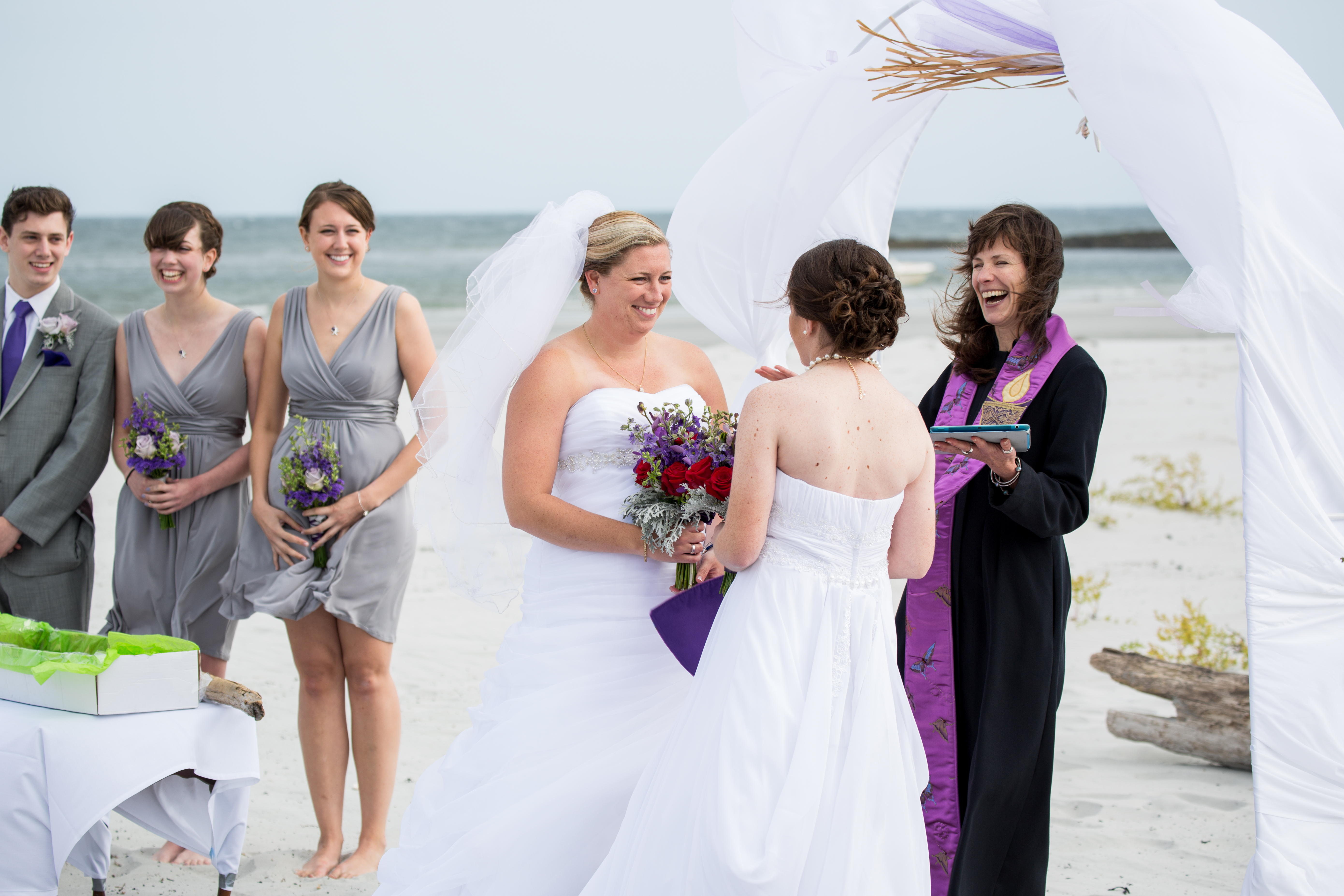 Two women getting married at the beach